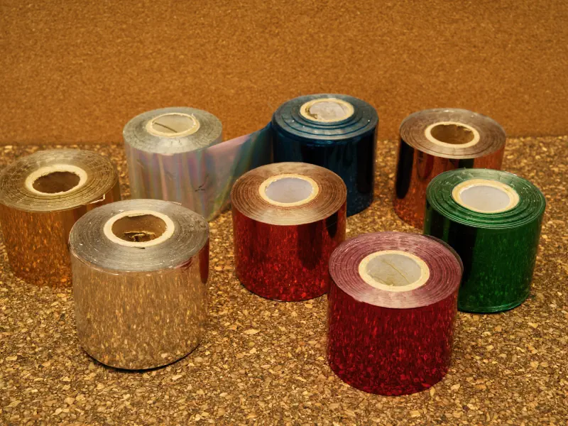 Rolls of coloured stamping foil in the Scribbly studio